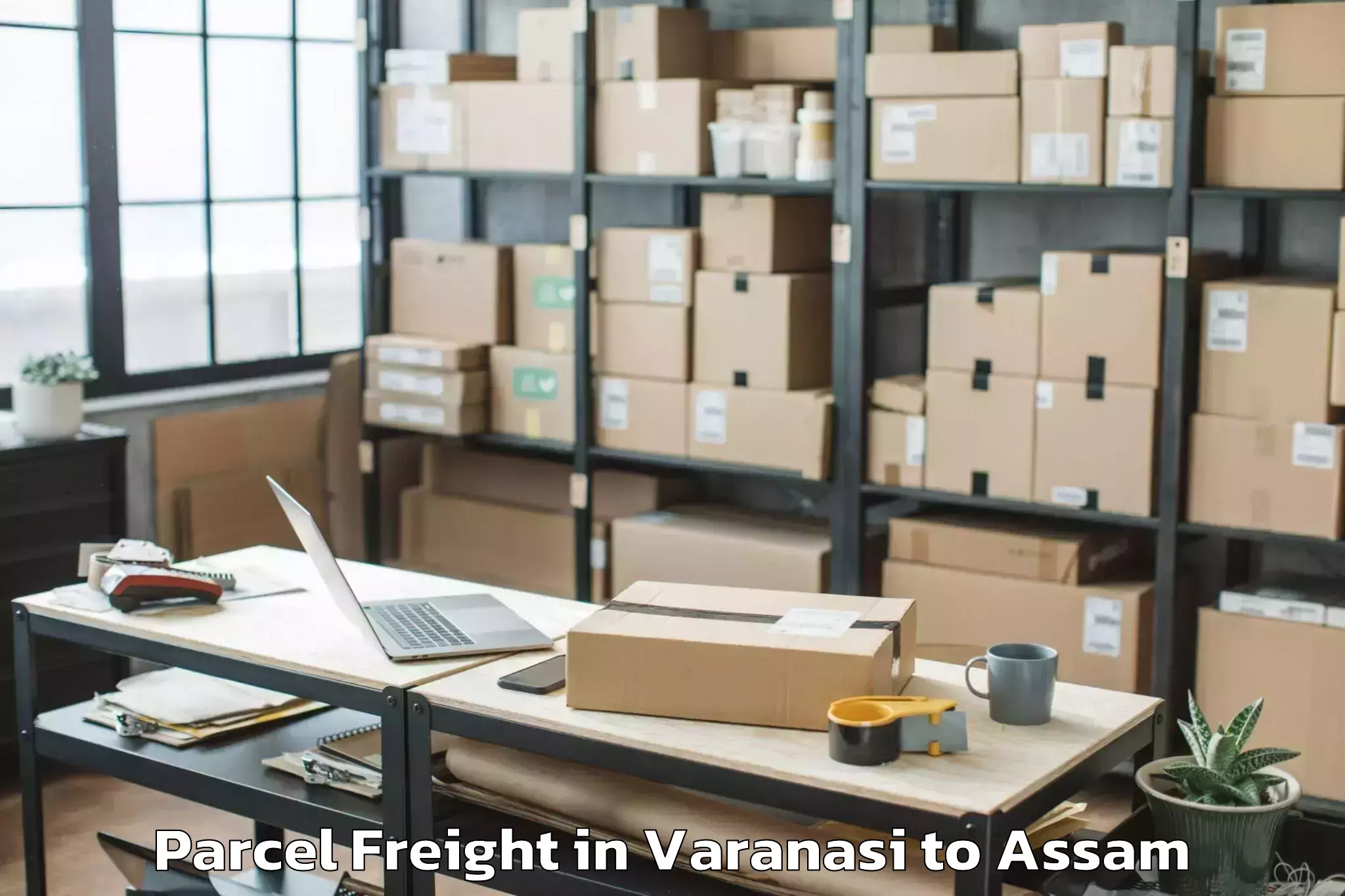 Book Varanasi to Lumding Railway Colony Parcel Freight Online